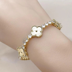 Luxury clover-shaped bracelet in gold finish with sparkling crystal accents